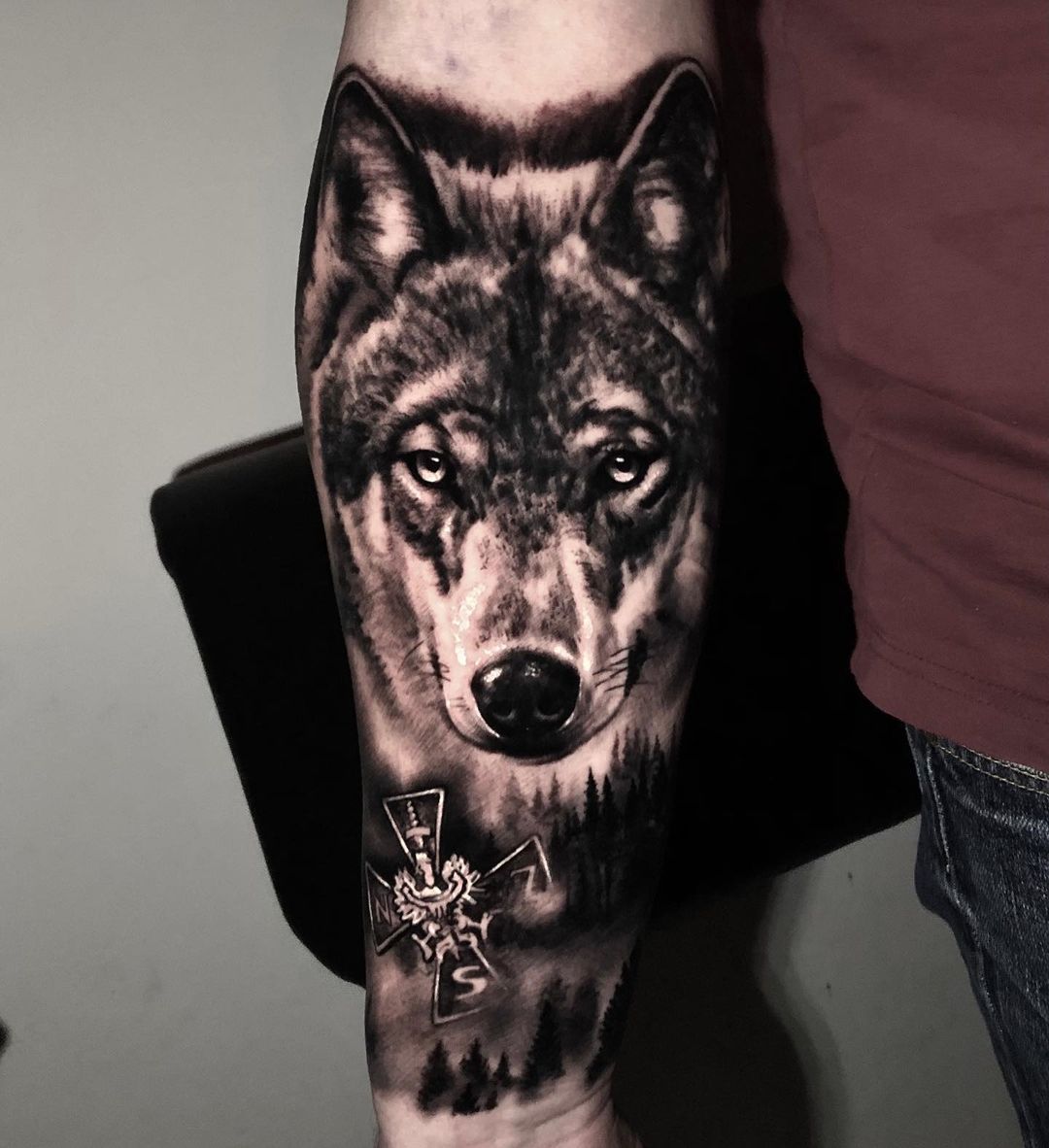 Viking Tattoo Inspired With Black Wolf Image Over Forearm 