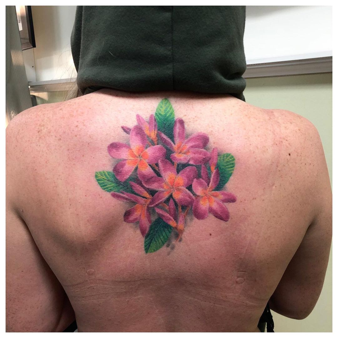 Tattoos Of Plumeria Flowers Over Back