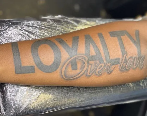 Bold and Poignant Forearm Statement Tattoo