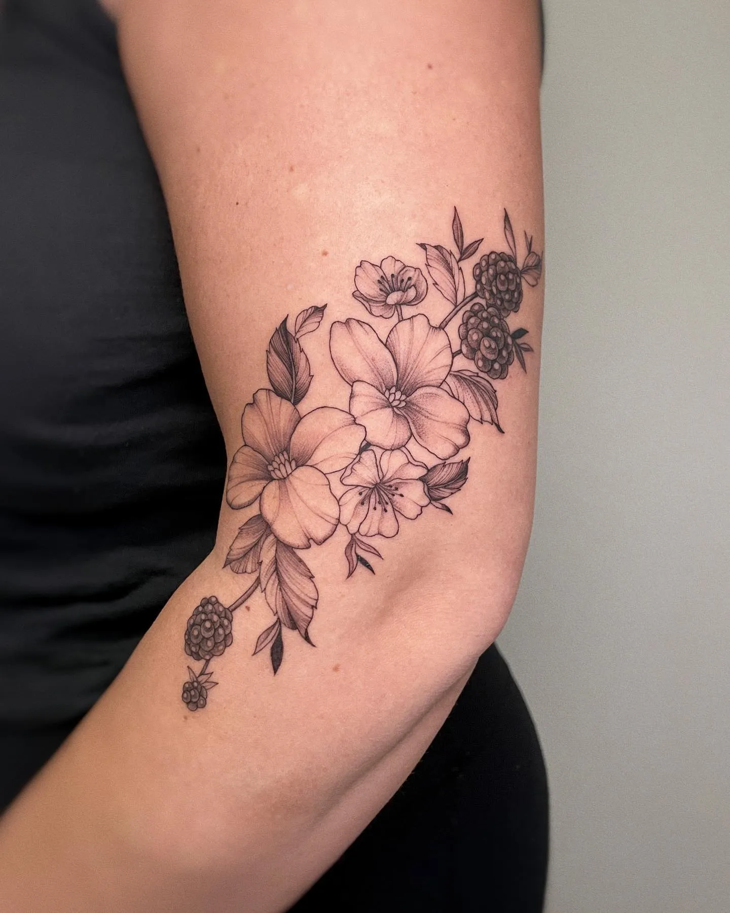 Botanical blackberry tattoo with flowers