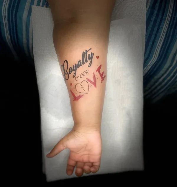 Child-like handwriting loyalty over love tattoo