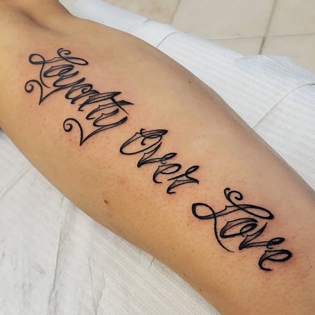 Curvaceous Script Tattoo with Emphasis on Trust