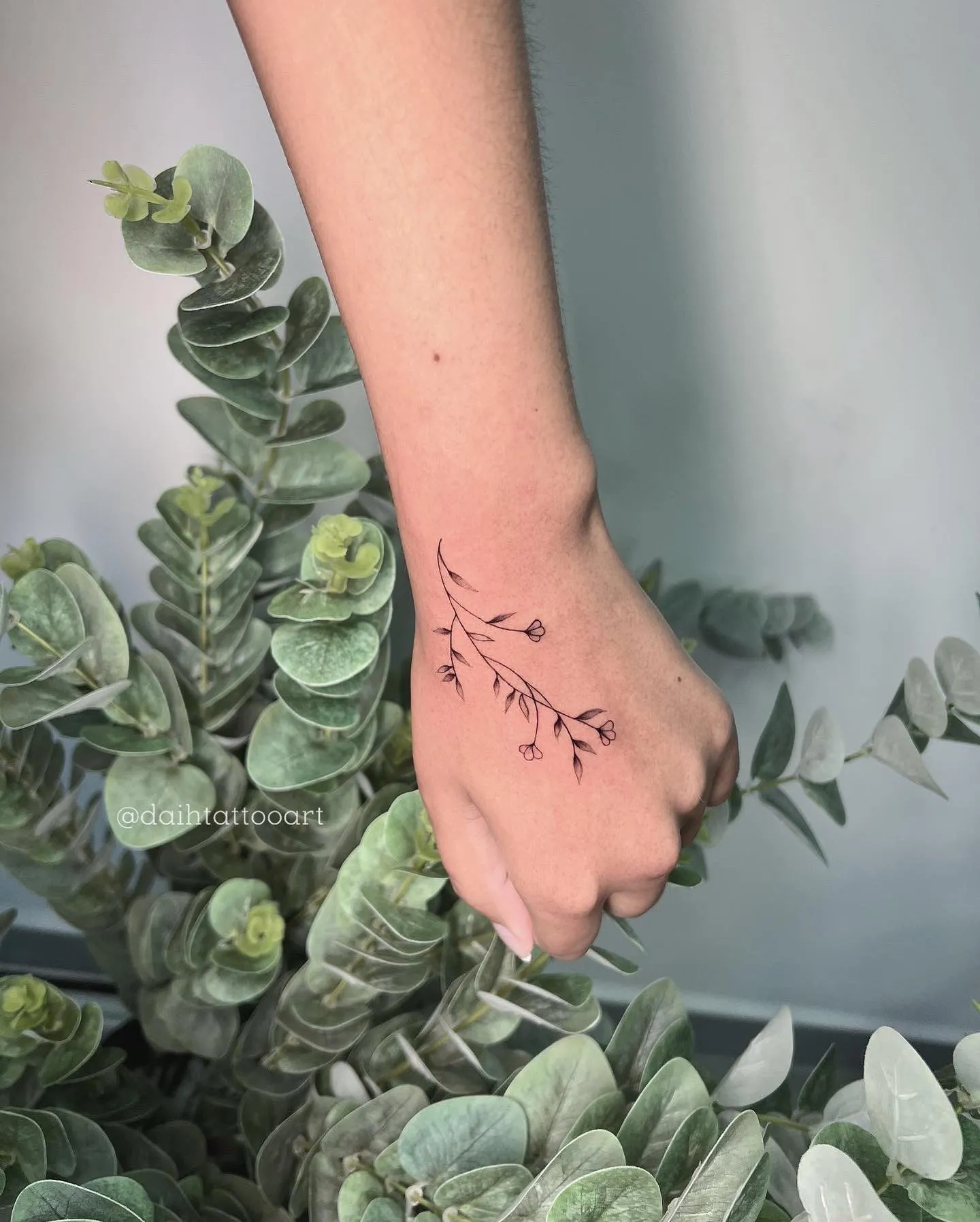 Dainty Twigs Side Hand Tattoo for a Natural Touch