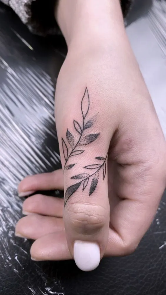 Delicate Leafy Branch Tattoo for Side Hand Look