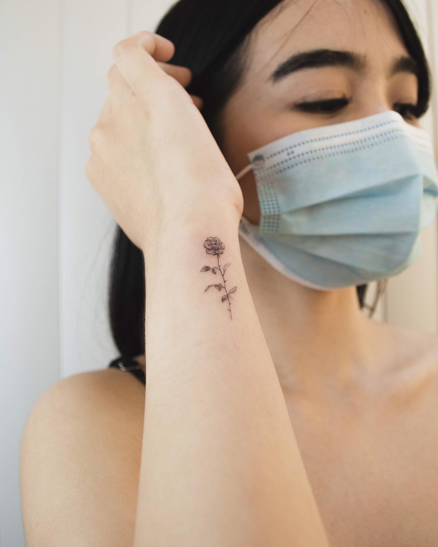 Delicate Single Rose Tattoo on Forearm
