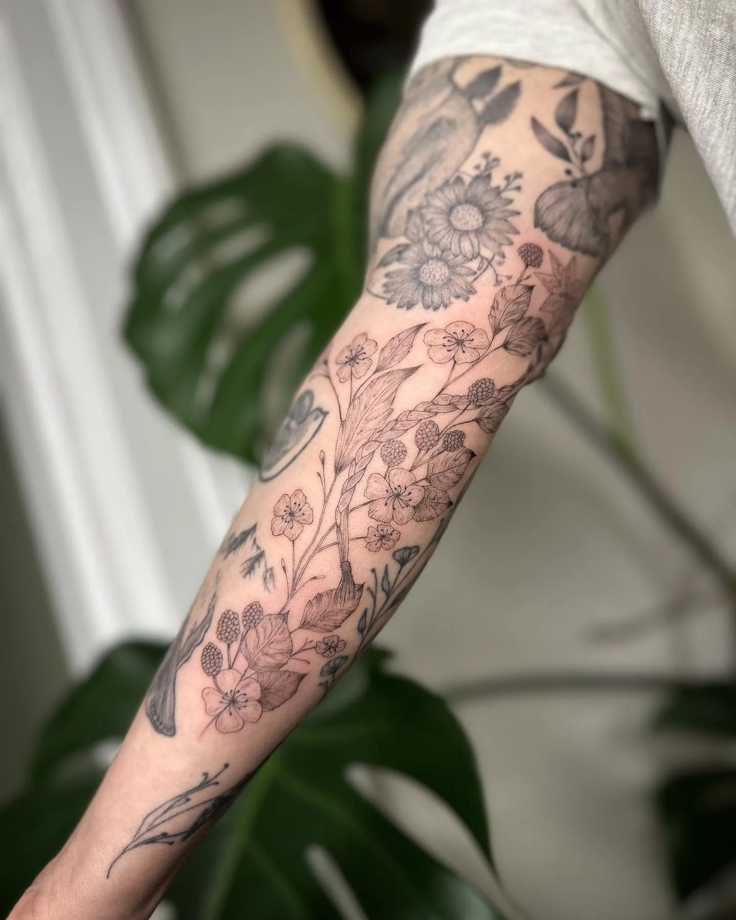 Delicate floral and blackberry sleeve art