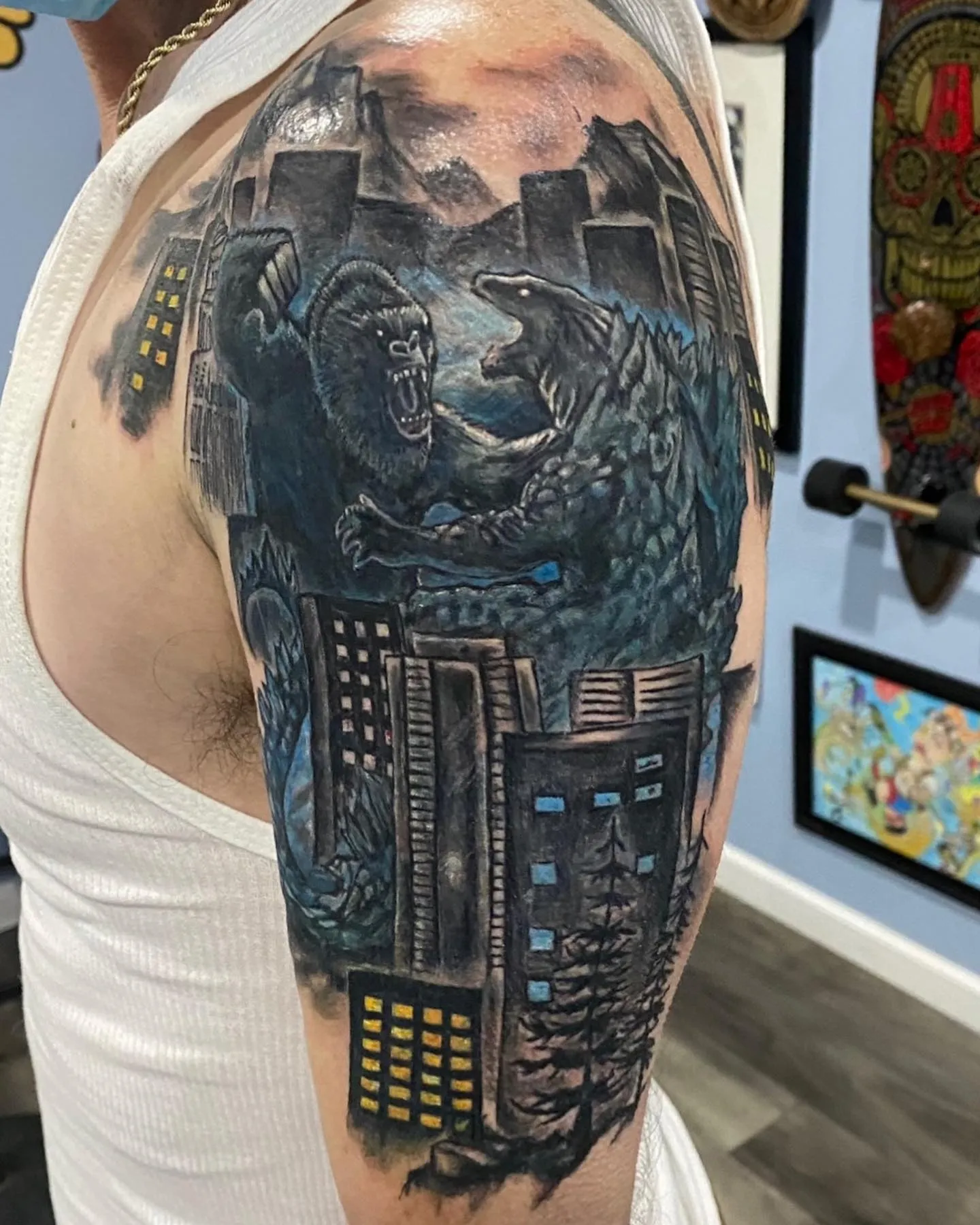 Dramatic Godzilla and Kong Cityscape Arm Tattoo