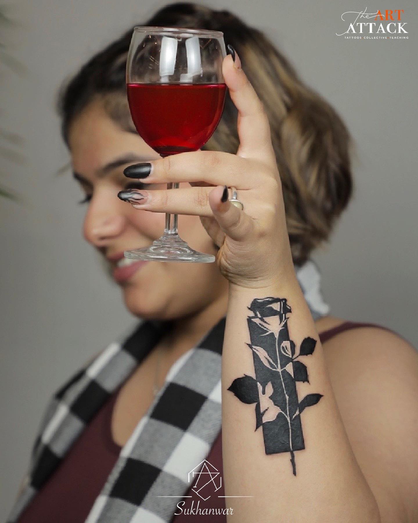 Elegant Black Rose Tattoo on Forearm
