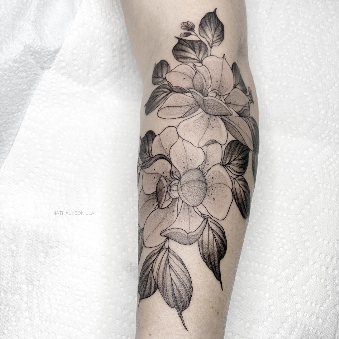 Elegant Black and White Floral Arm Tattoo