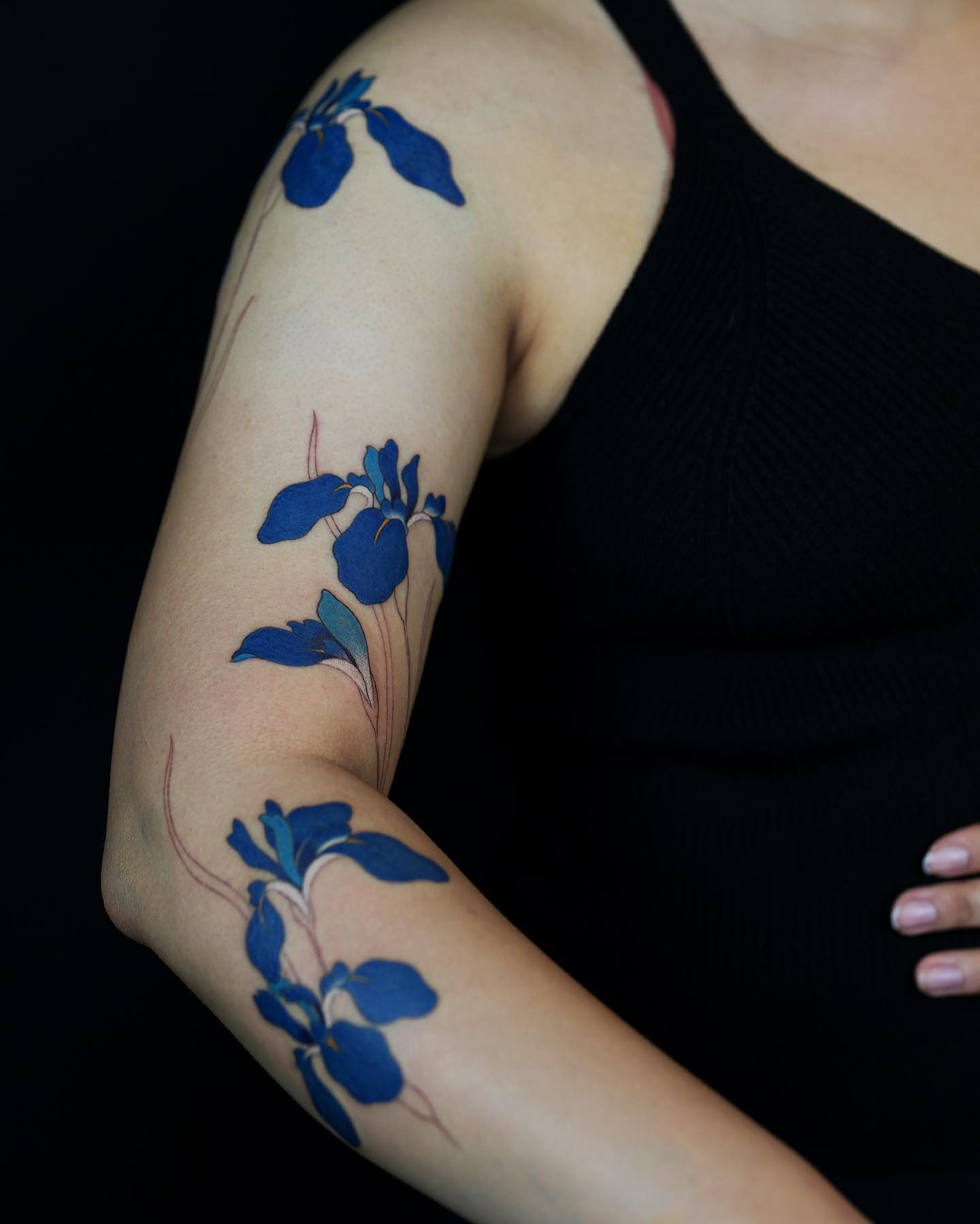 Elegant Blue Floral Arm Tattoo