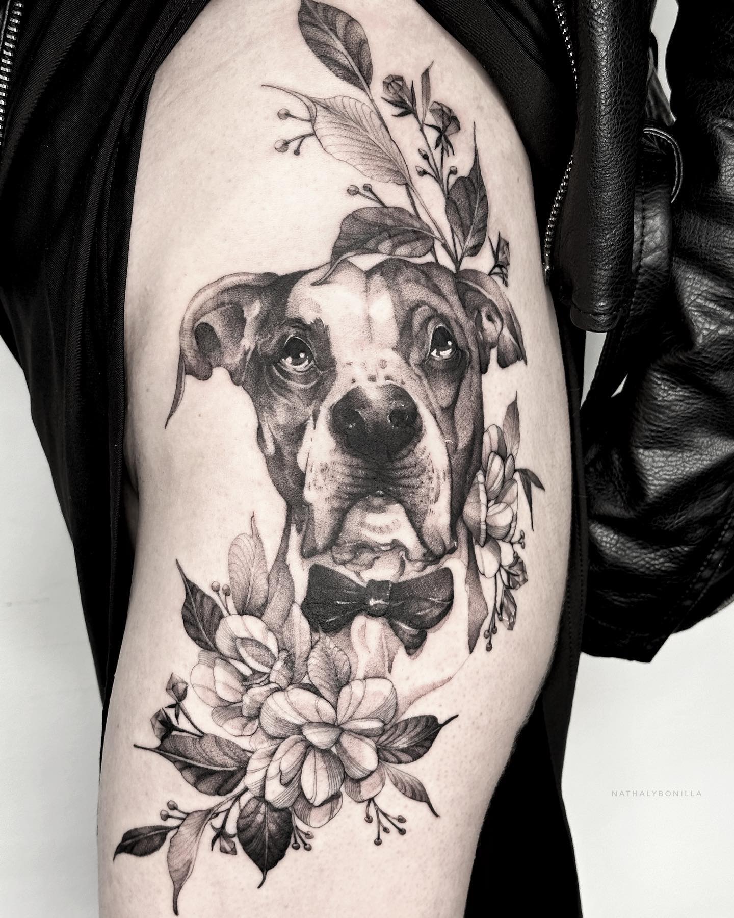 Elegant Dog Portrait Surrounded by Flowers Tattoo