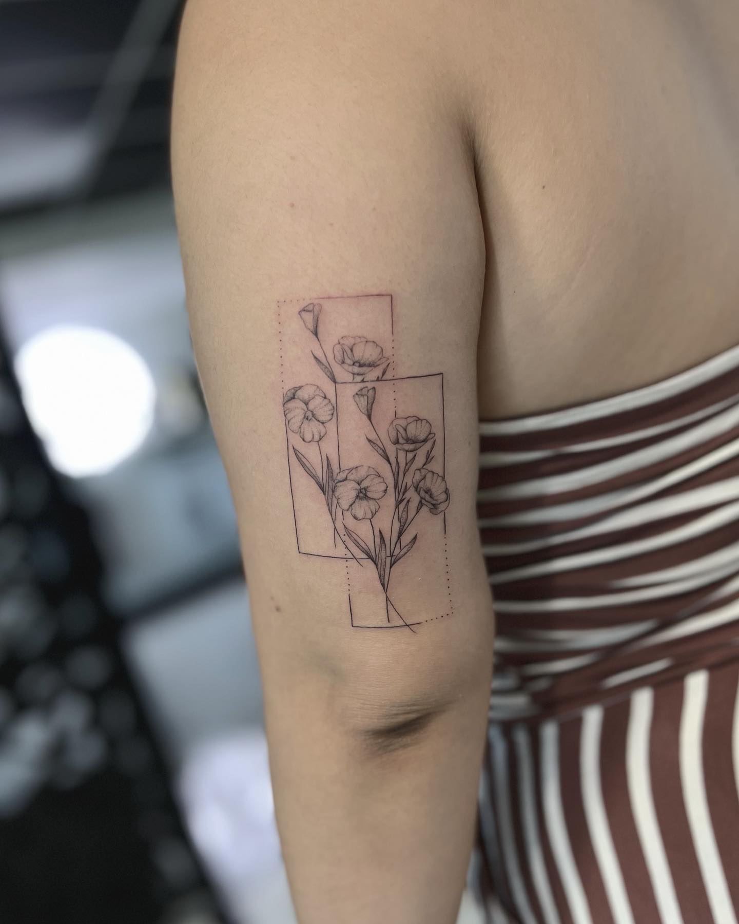 Elegant Geometric Floral Tattoo on Forearm