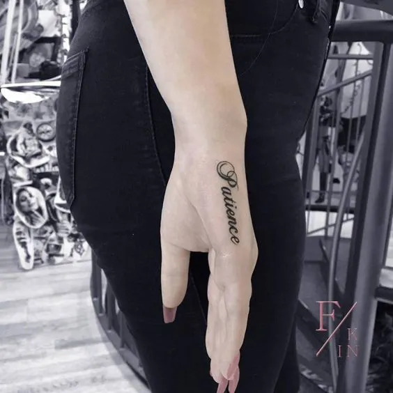 Elegant Patience Script Side Hand Tattoo