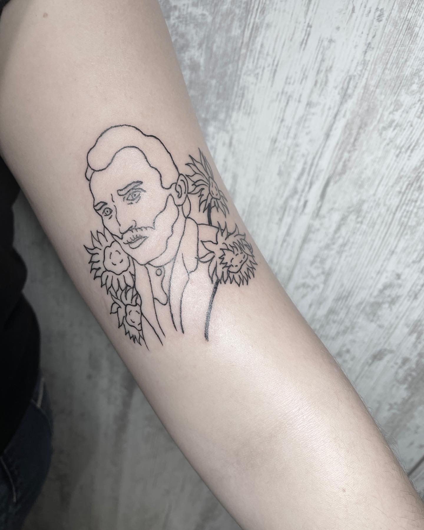Elegant Portrait Tattoo with Floral Embellishments