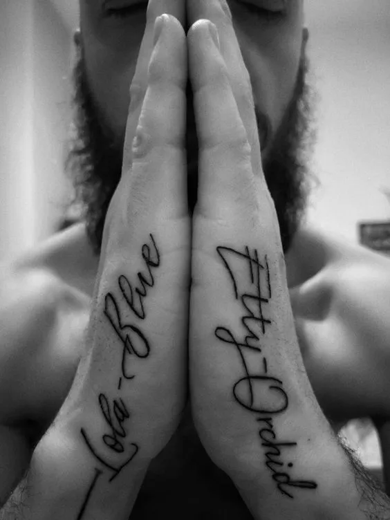 Emotive cursive script side hand tattoo for men