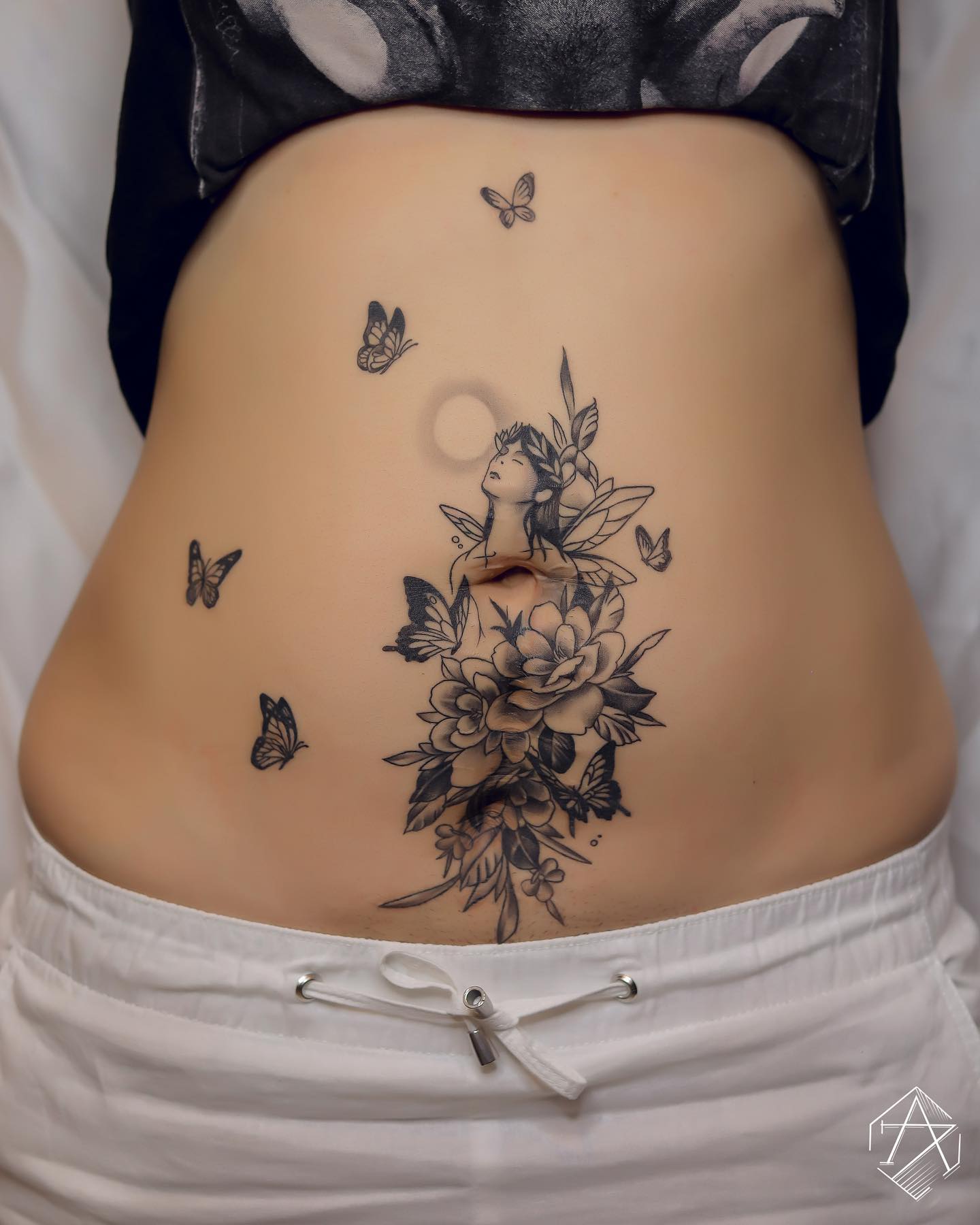 Ethereal Woman with Flowers and Butterflies Tattoo