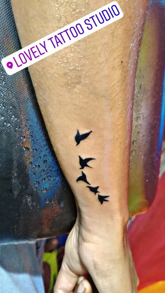 Flight of Birds Side Hand Tattoo Accentuating Freedom