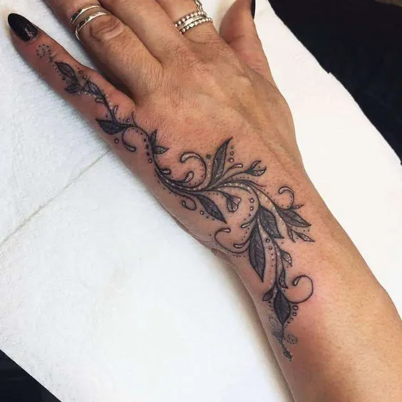 Flourishing Side Hand Tattoo with Fine Detail