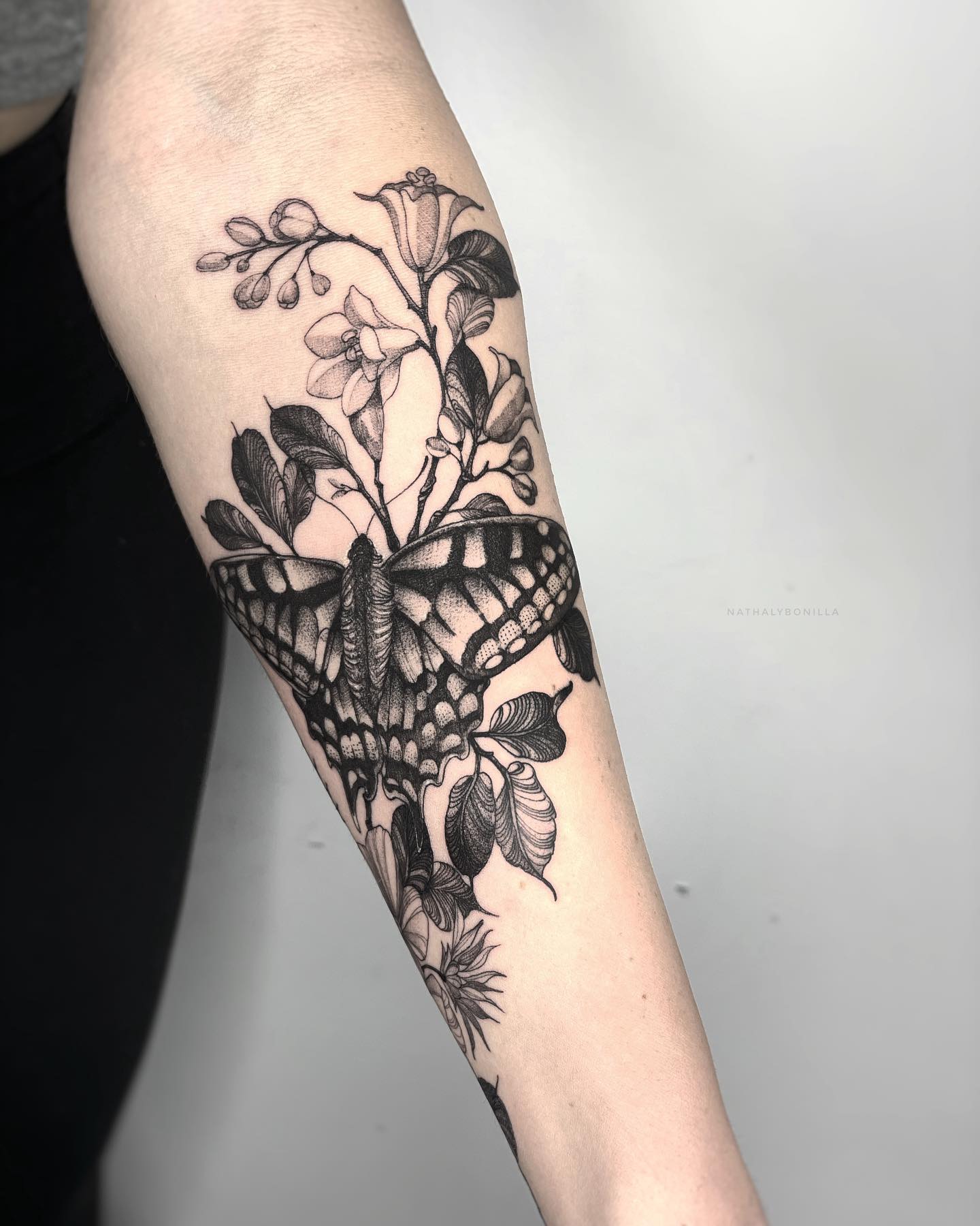 Intricate Butterfly and Floral Arm Tattoo
