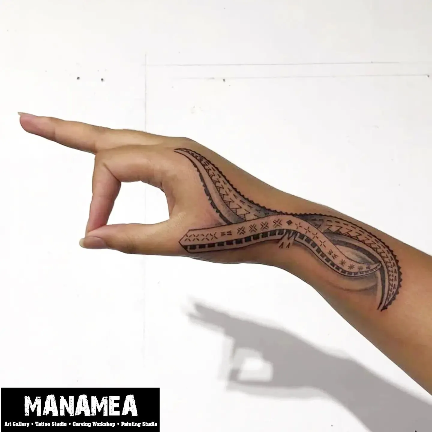Intricate Polynesian Style Tattoo Art on Hand Side