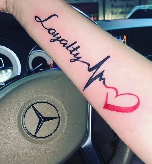 Loyalty Over Love with ECG and Heart Symbol Forearm Tattoo
