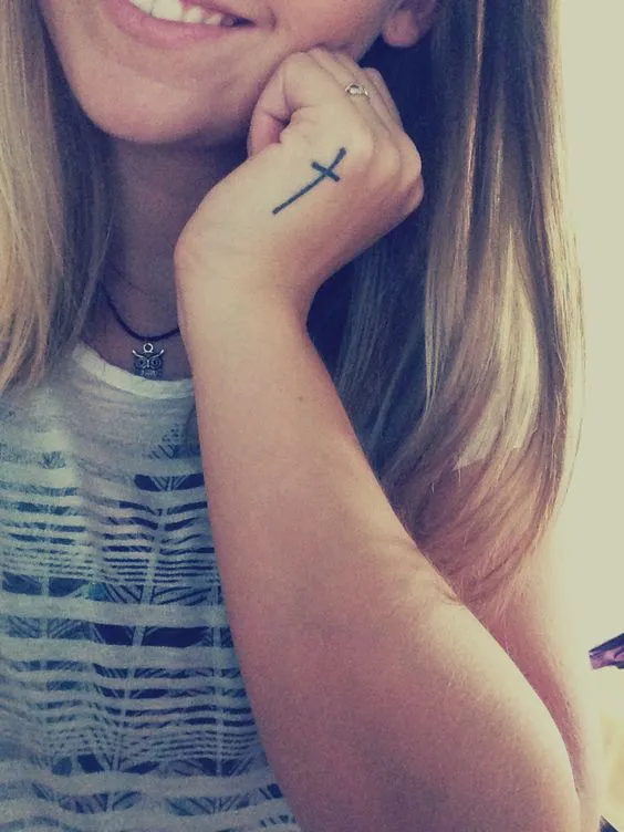 Minimalist Cross Tattoo for a Faith-Inspired Hand Side