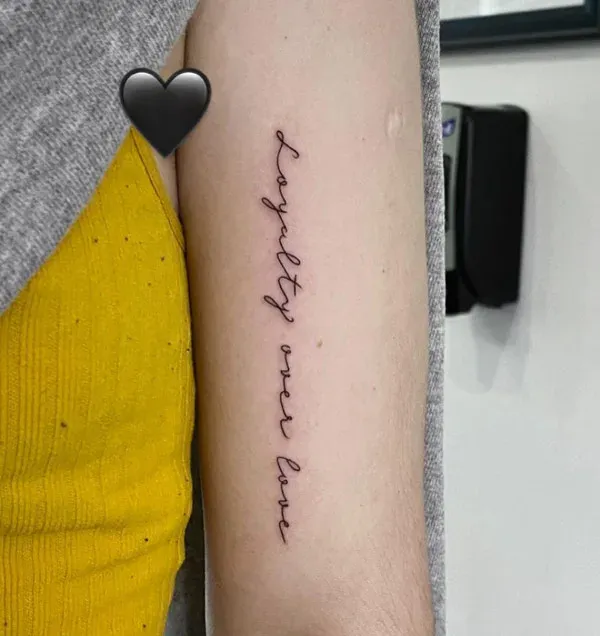 Minimalist Loyalty Over Love Forearm Script Tattoo