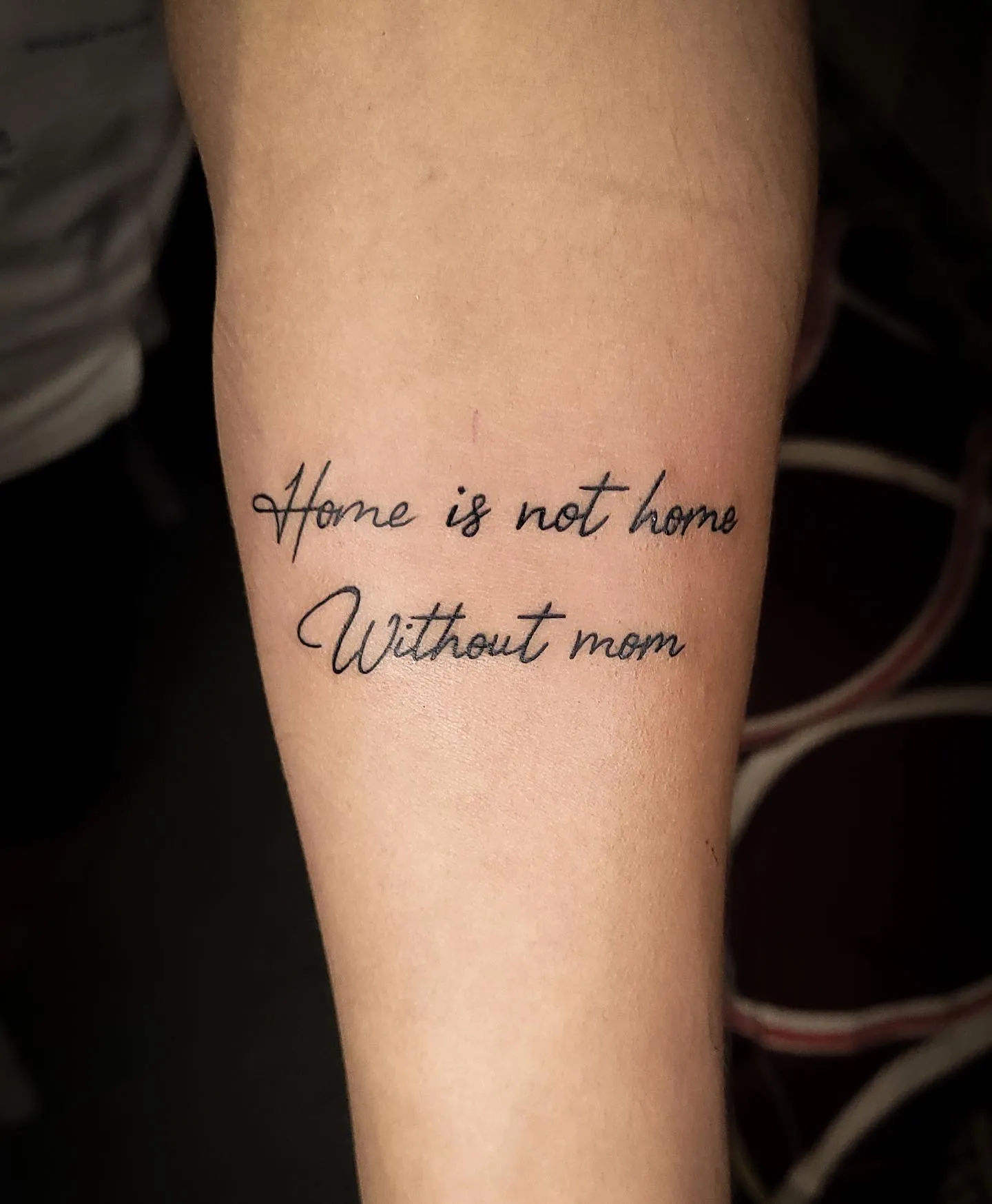 Nostalgic Script Tattoo Reflecting Home and Mom