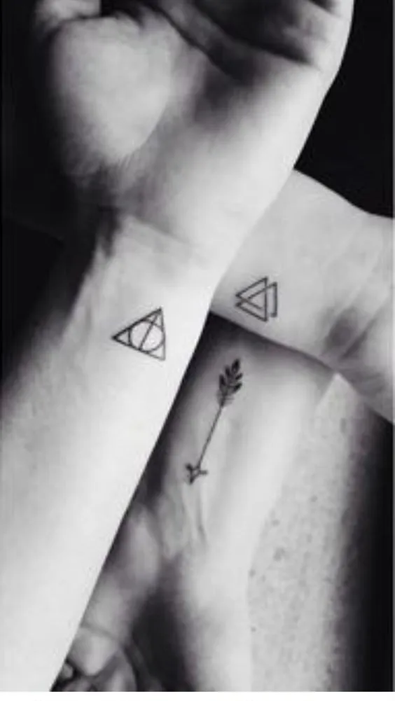 Paired Triangle Tattoos with Simplistic Charm