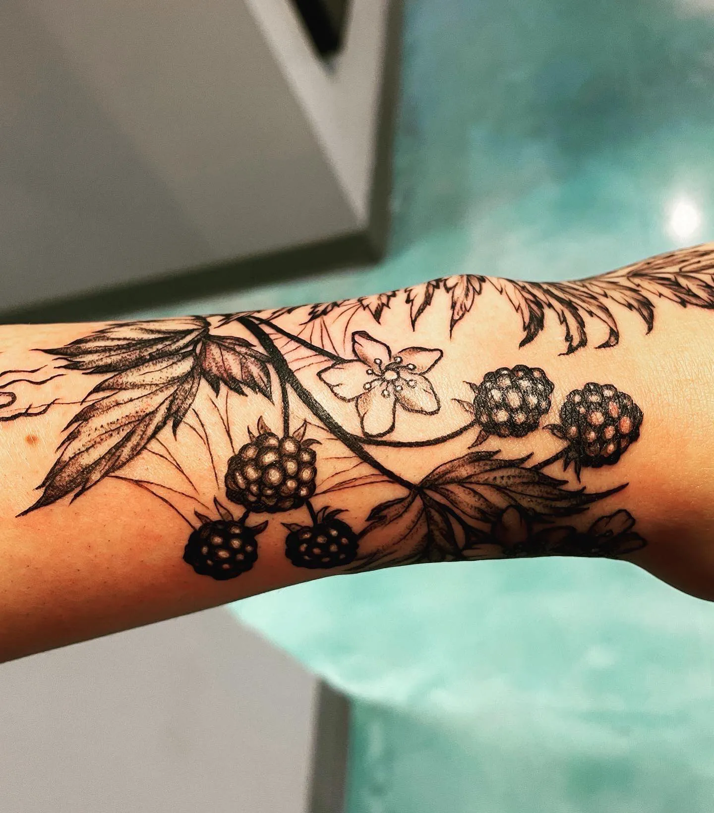 Rich blackberry vine tattoo on wrist