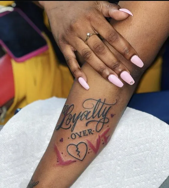 Romantic Script Tattoo with Symbolic Imagery