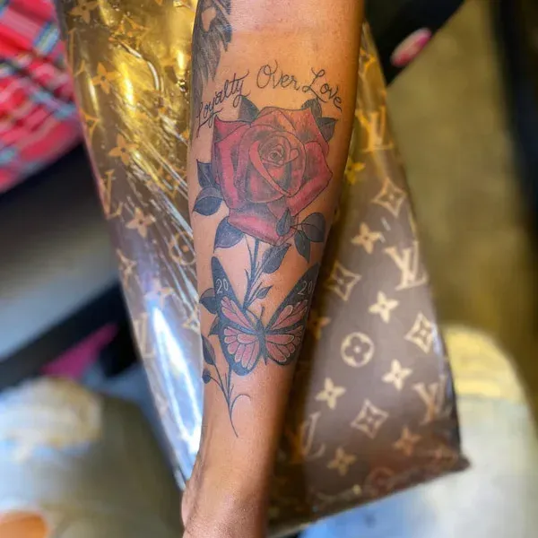 Rose Embellished Forearm Tattoo with Meaning