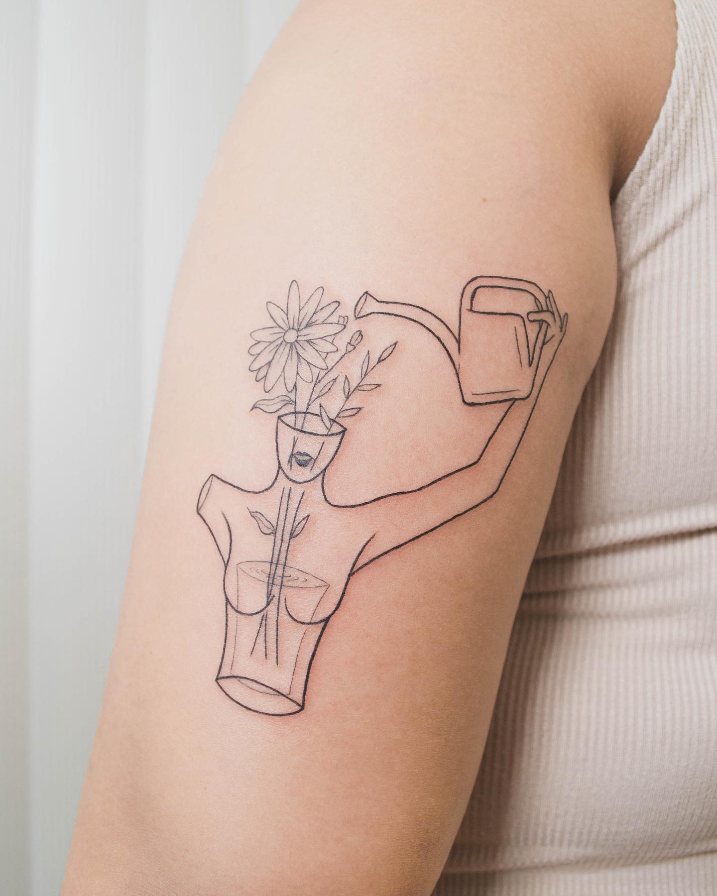 Simple Floral Tattoo with Watering Can Design