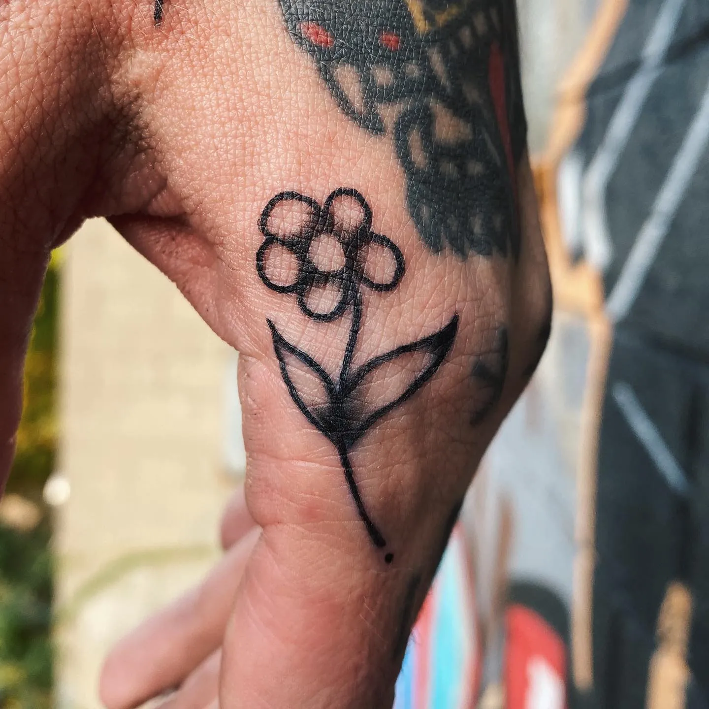 Simple flower design for side hand tattoo ideas