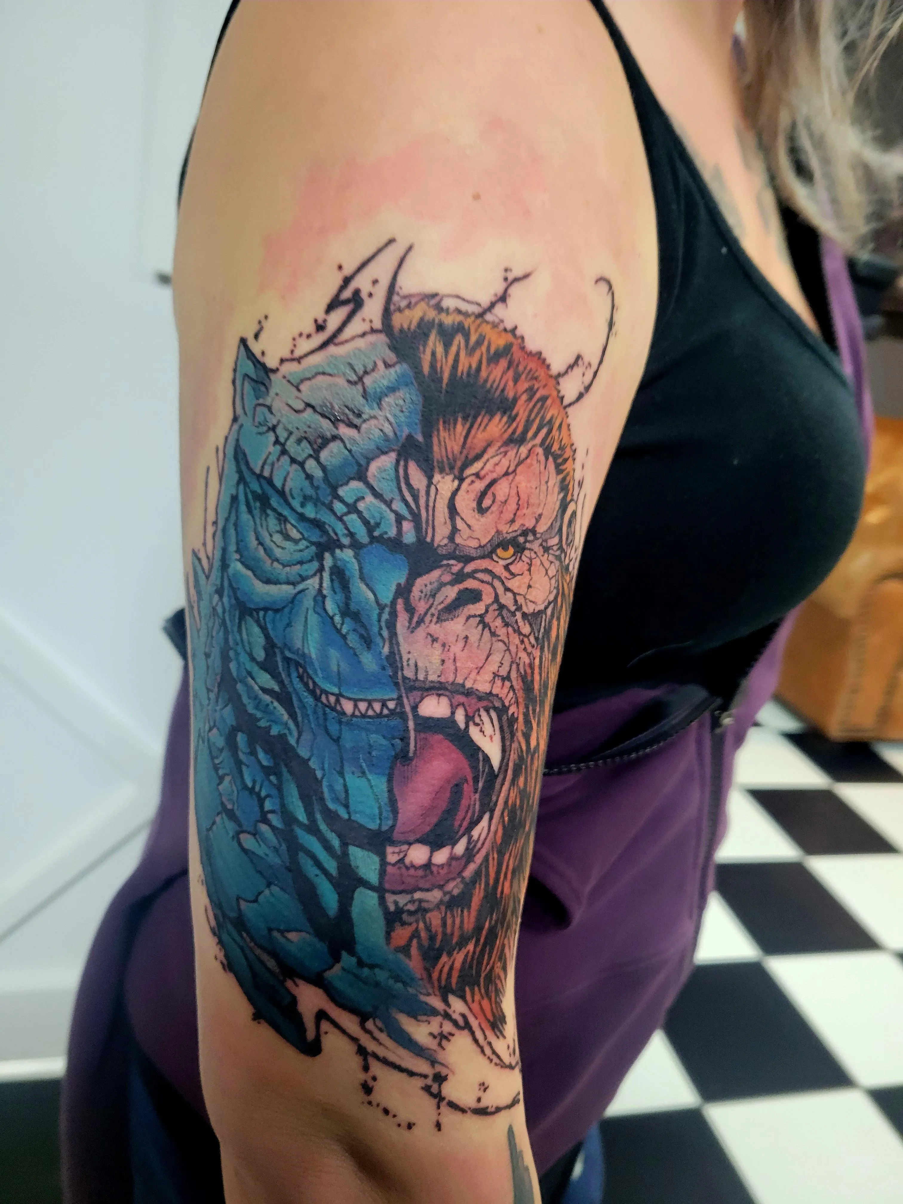 Vibrant Shoulder Tattoo of Kong and Godzilla