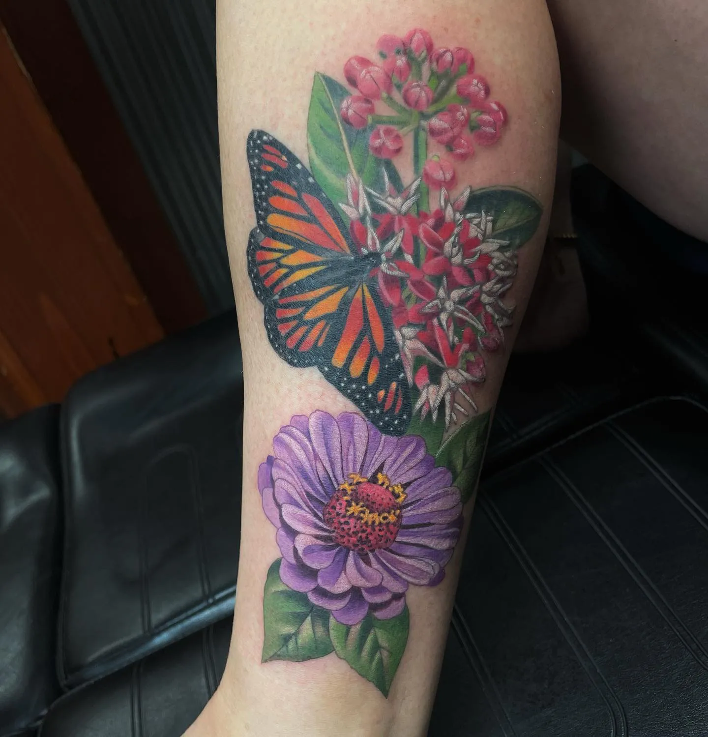 Vivid Zinnia Flower Tattoo with Butterfly Companionship