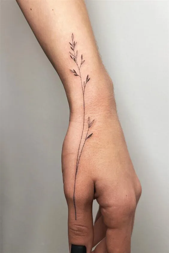Whimsical Floral Stem Tattoo on Hand Side