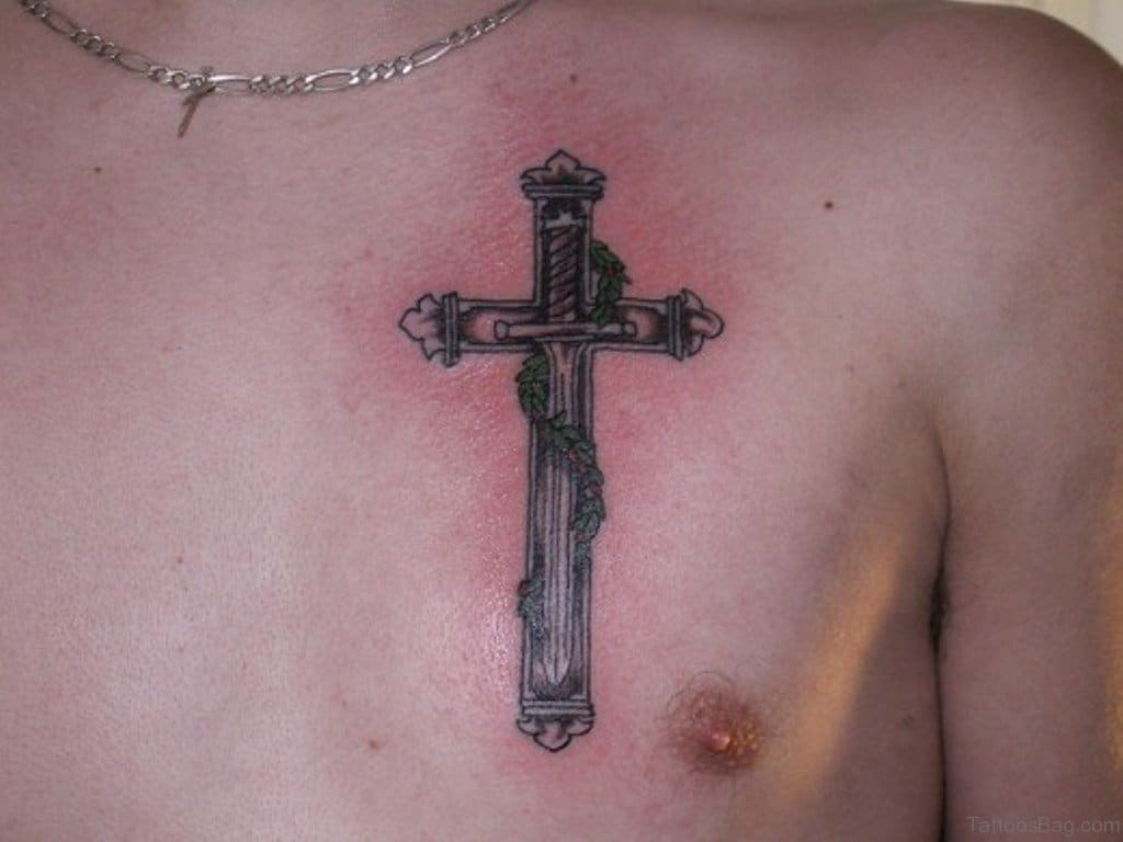 Sword in the middle of cross tattoo