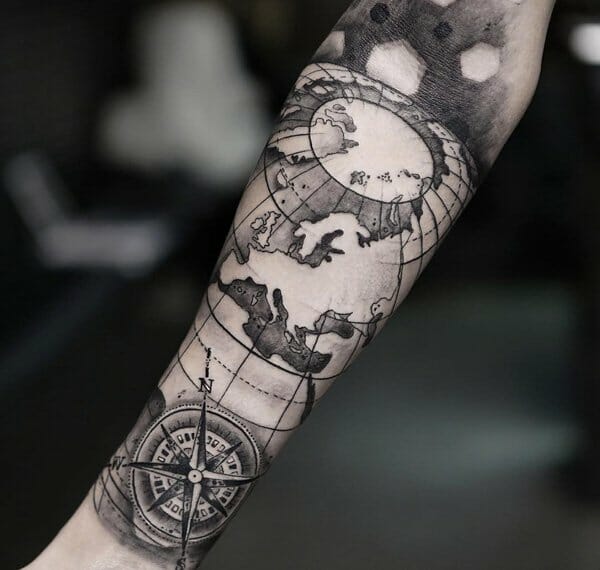 compass and map forearm tattoo