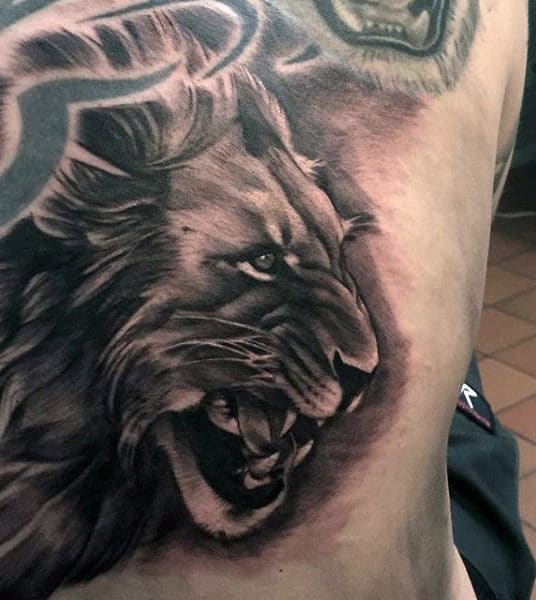 Lion Eyes Chest Tattoo