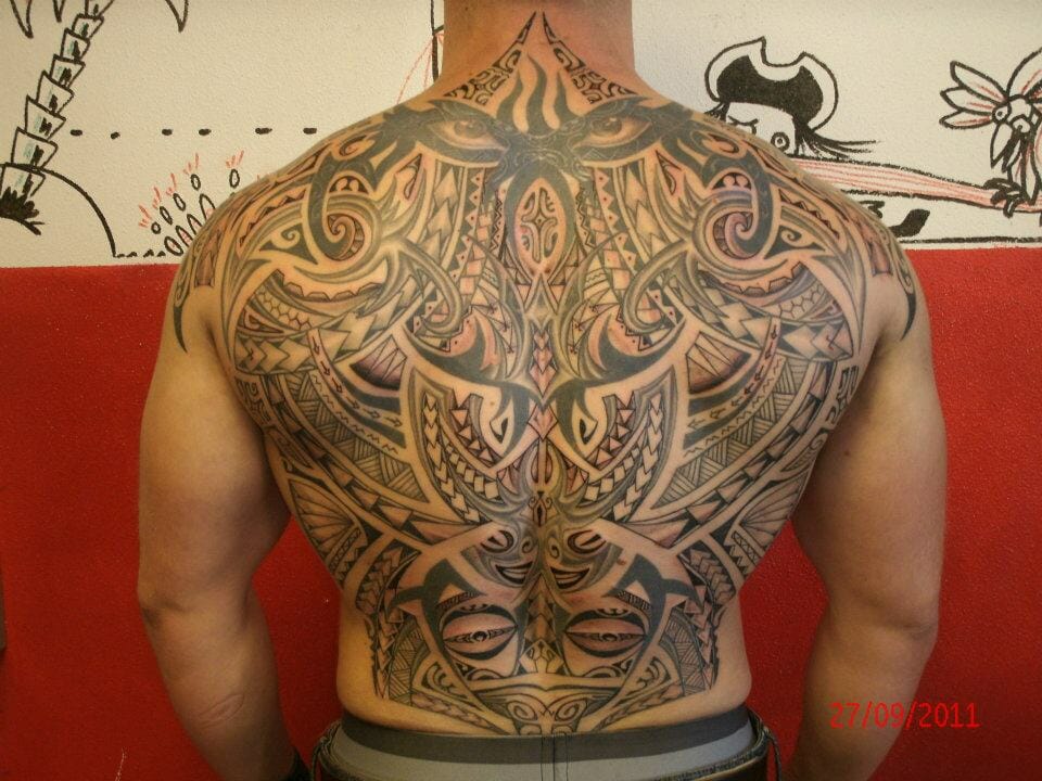 Amazing Tribal Back Tattoo