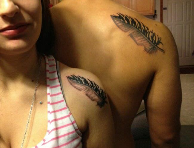 Couples Feather Tattoos on a shoulder