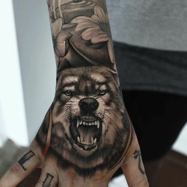 Roaring Wolf Hand Tattoo