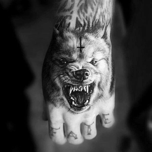 Aggressive Wolf Hand Tattoo