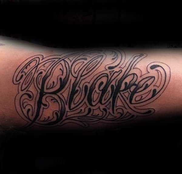 "Black" Ornate Name Tattoo On Arm