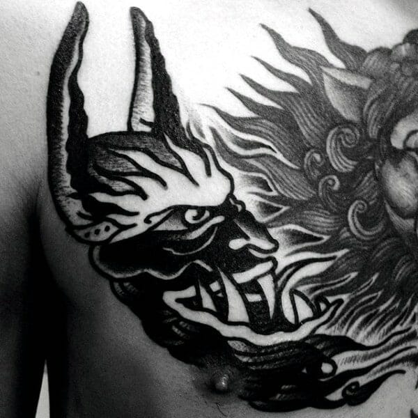 Tribal Demon Chest Tattoo