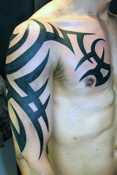Cool Old School Tribal Arm & Chest Tattoo