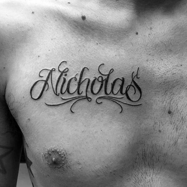 Cursive "Nicholas" Upper Chest Name Tattoo 