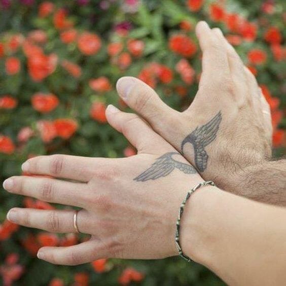Heart with Wings Couples Hand Tattoo