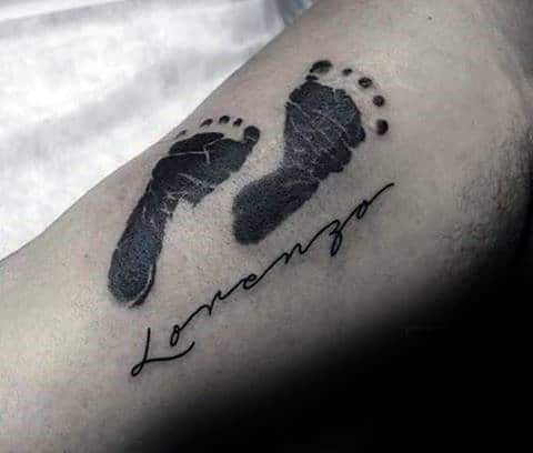 Footprints and Name Forearm Tattoo